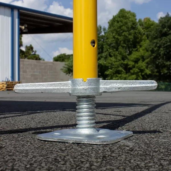 Level Jack installed at the base of a scaffold frame.